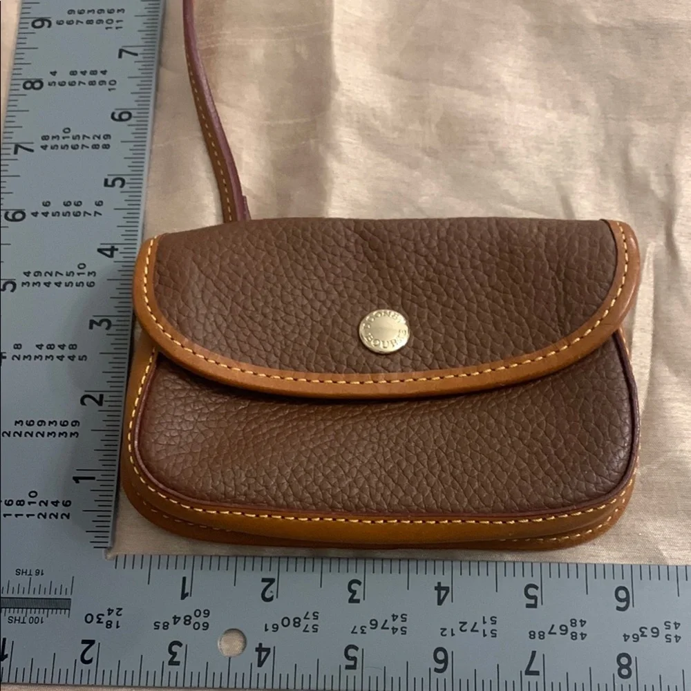Dooney & Bourke Leather with Flap Closure and Wristlet NEVER USED LIKE NEW